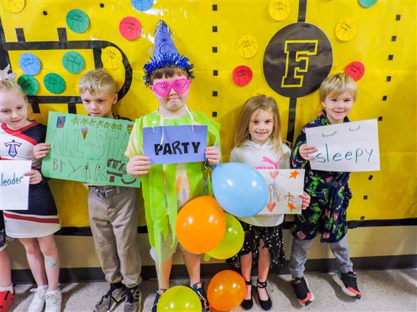 Students and teachers dressing up for a vocabulary parade. 